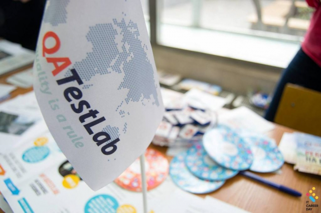 QATestLab flag at career fair
